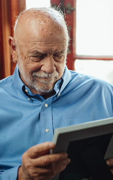 resident looking at a framed photo