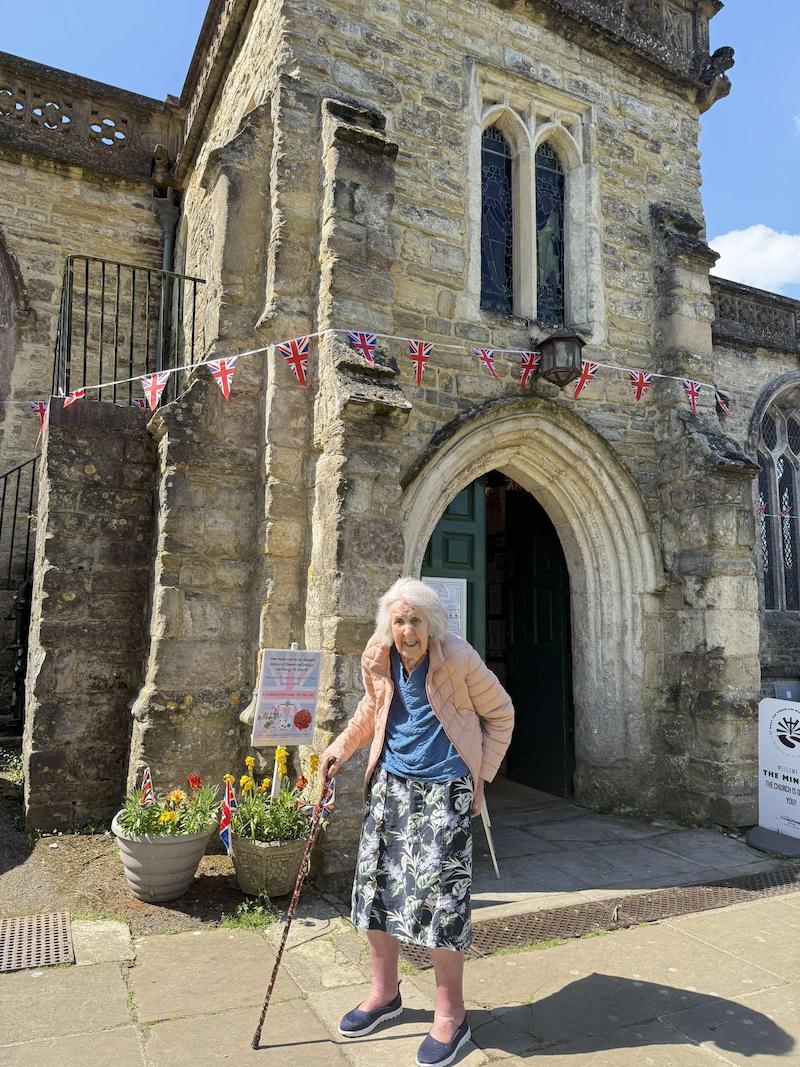 resident stood outside the church on VE day