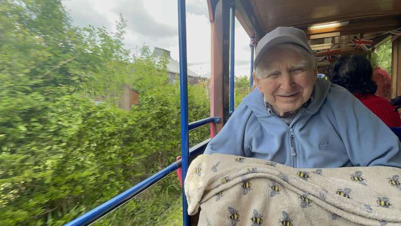resident smiling on the tram