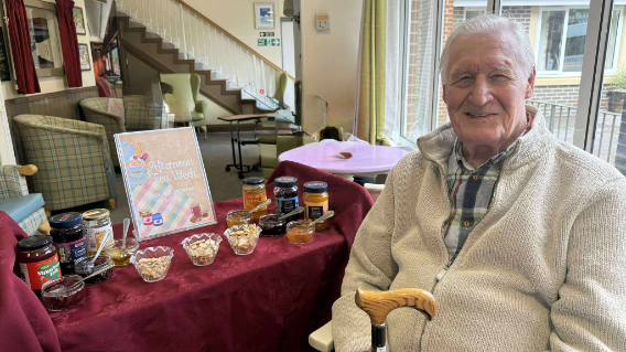 Resident with cakes on the table